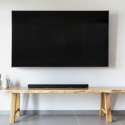 pexels photo 6020432 6020432 Stylish minimalist living room featuring a wall-mounted flat screen TV and wooden console.